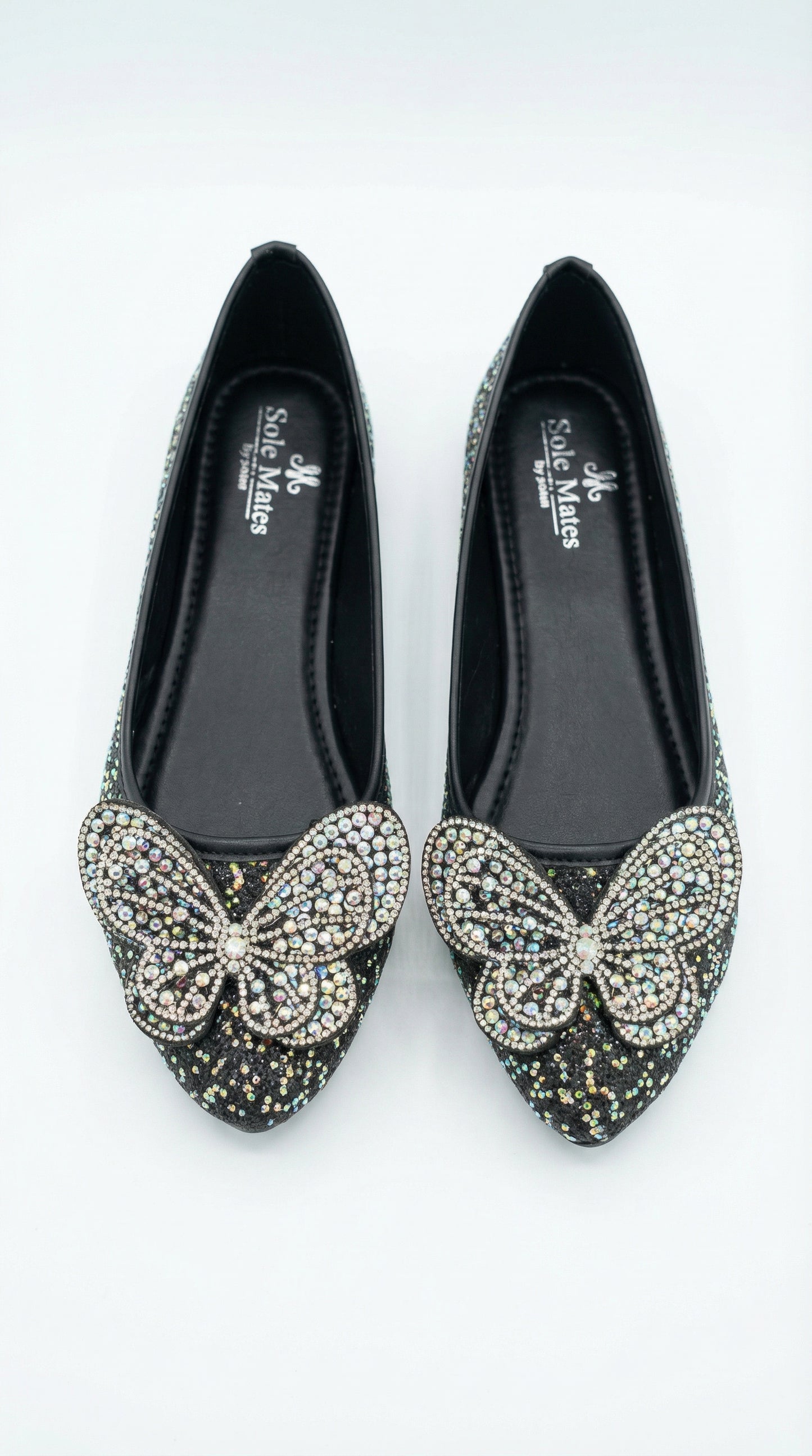 Midnight Flutter ballerina front view — crystal butterfly with AB stones and pearl centre on black glitter by
Solemates by Palak