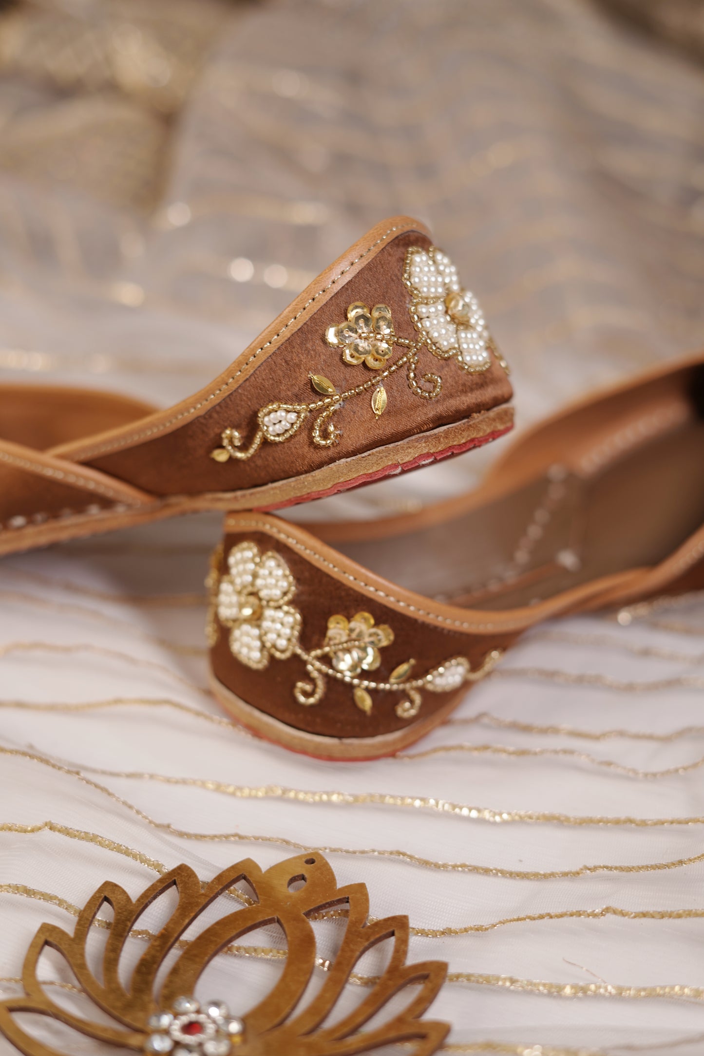 Mocha Juttis side and sole detail — tan leather border with pearl and gold embellishments by Solemates by Palak