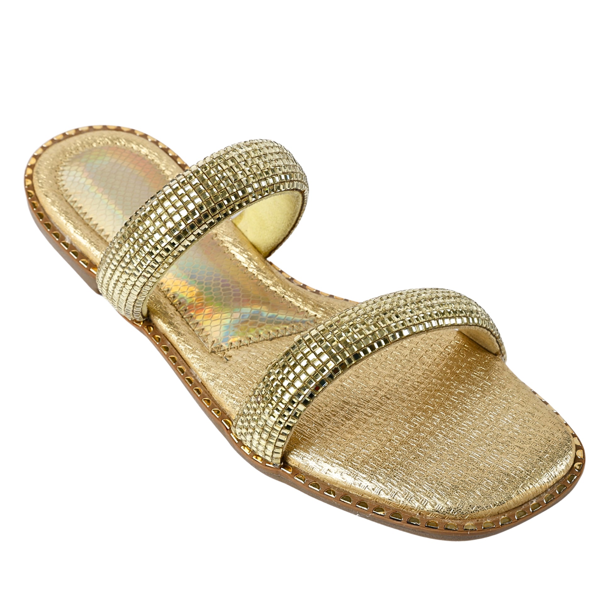 Angled view of Crystalline Gold Flats by Solemates by Palak — double strap flat sandal with fully crystal-set gold straps, holographic inner lining and gold stud sole trim, white background
