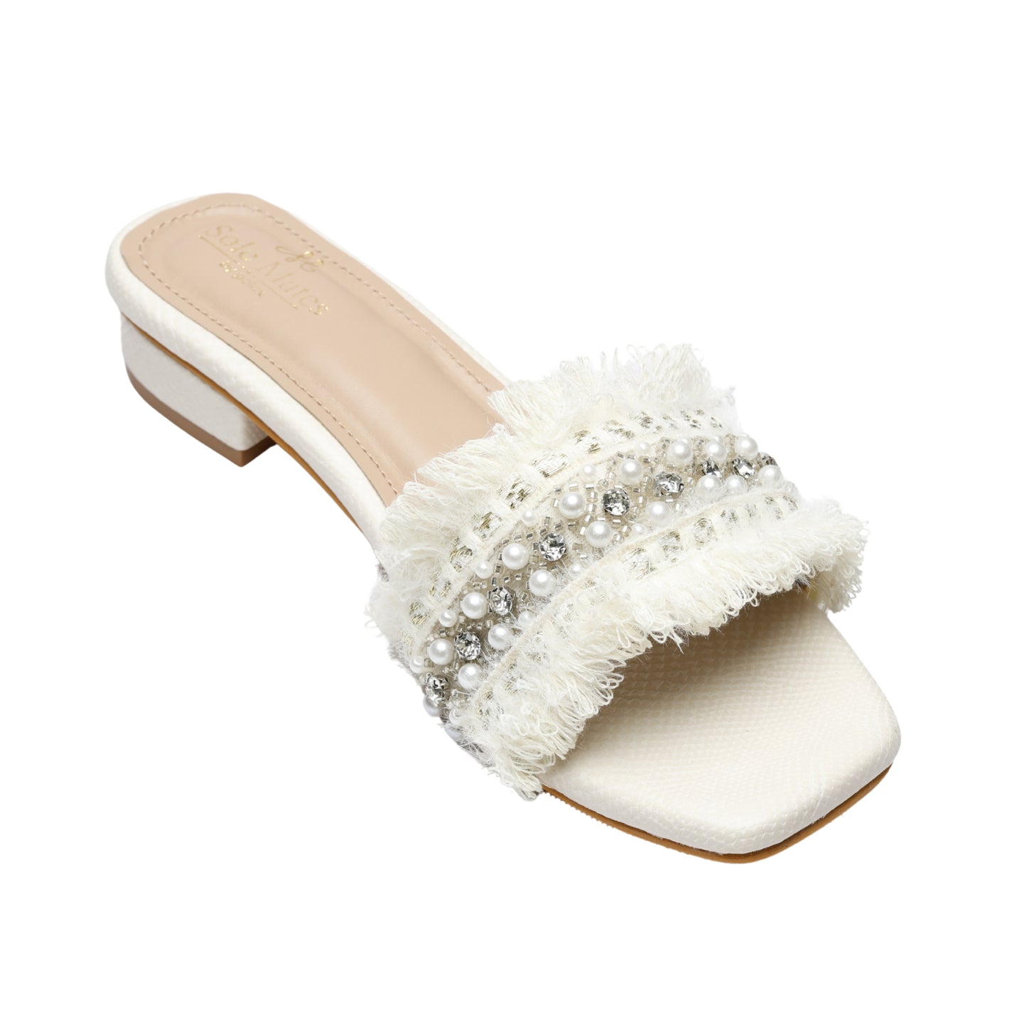 Angled full view of Boho Chic Ivory slider by Solemates by Palak — ivory woven-texture base with low block heel, soft fringe strap and pearl and crystal embellishment, white background