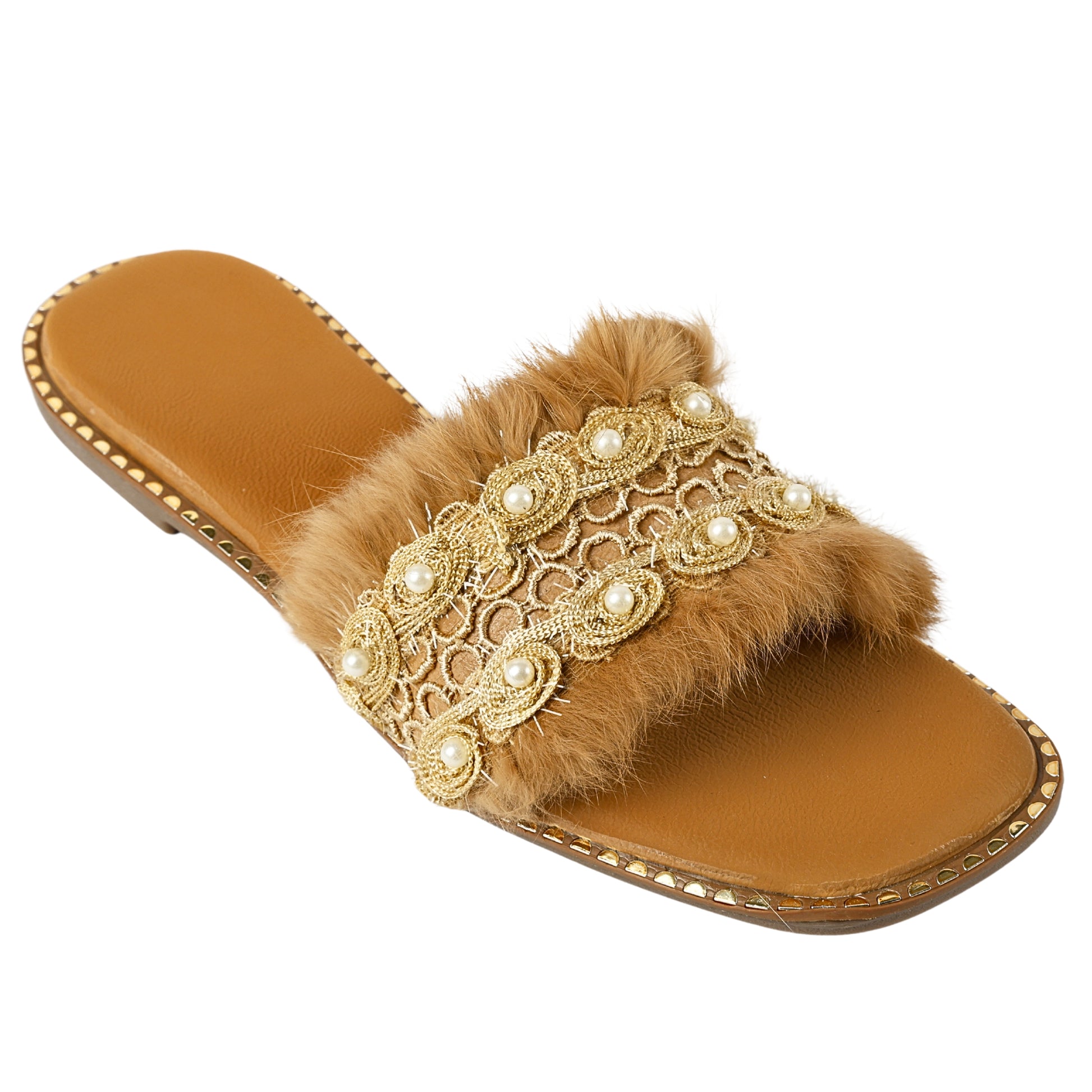 Angled view of Furry Brown flat slider by Solemates by Palak — tan caramel pebbled base with square toe, warm brown fur strap, gold lace appliqué and gold stud sole trim, white background