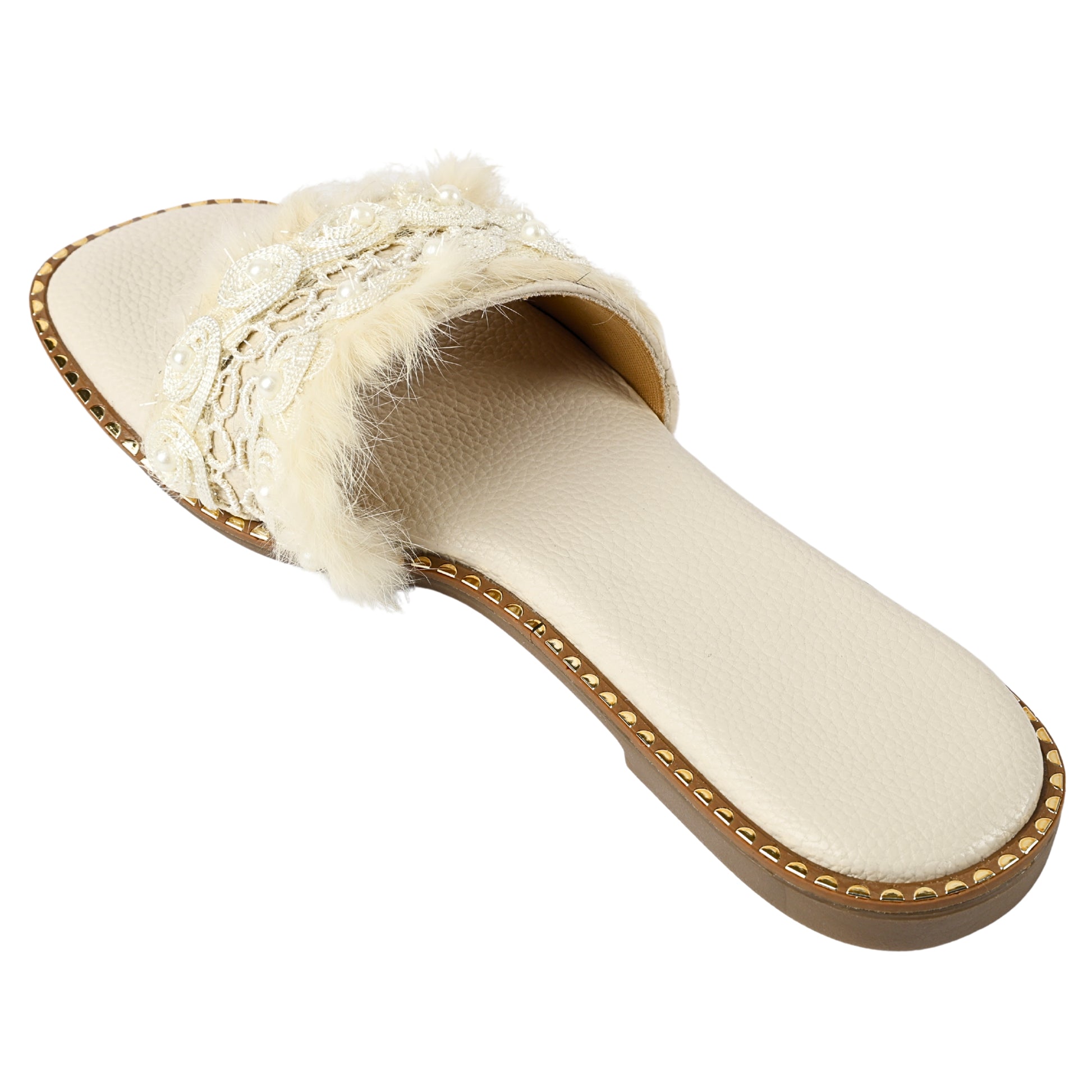 Angled view of Furry Ivory flat slider by Solemates by Palak — ivory pebbled-texture base with square toe, cream fur strap, floral lace appliqué and gold stud sole trim, white background