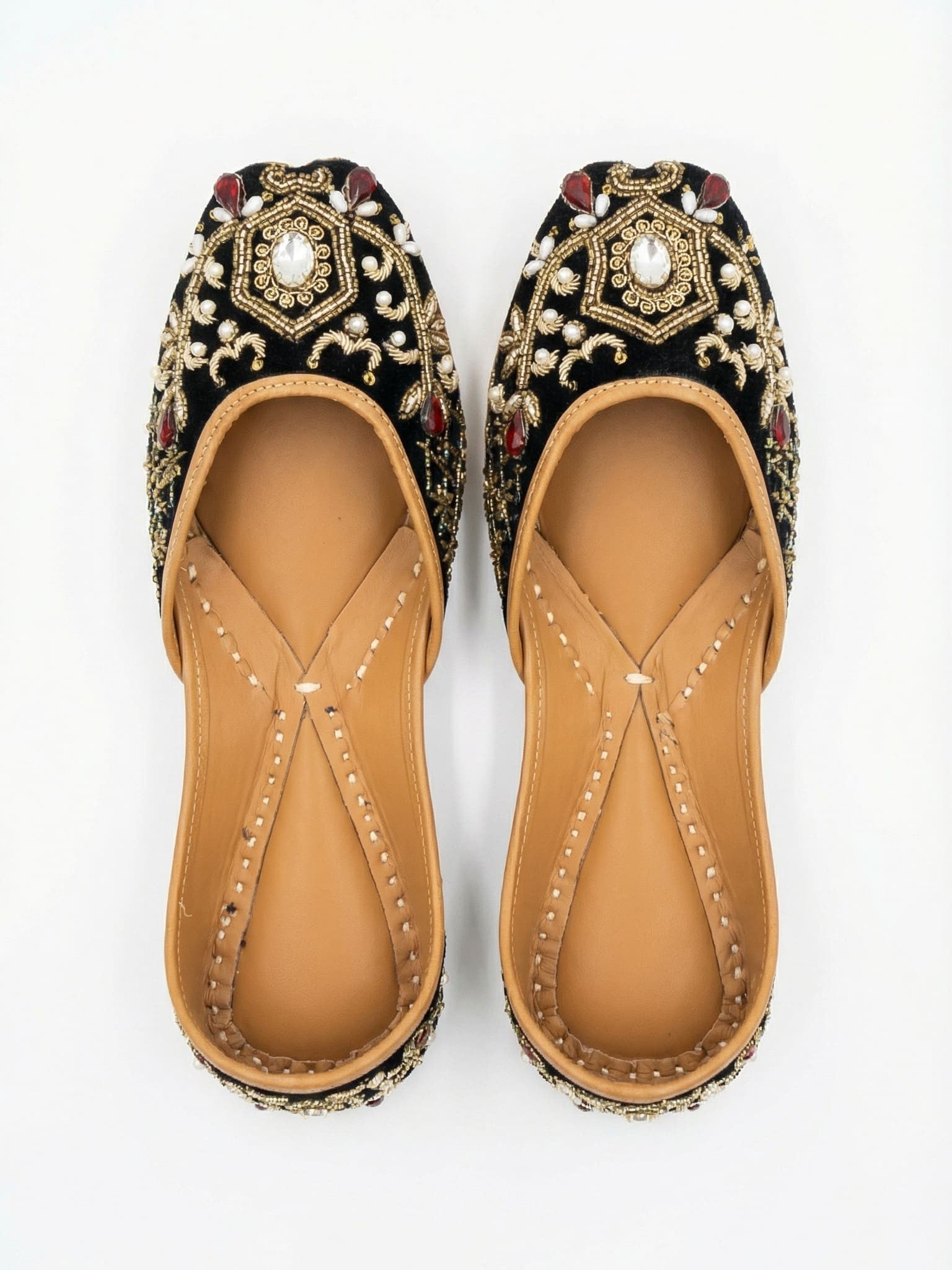 Sahiba black velvet juttis top view — gold zari, mirror centerpiece, pearl and ruby stone embellishments by Solemates by Palak
