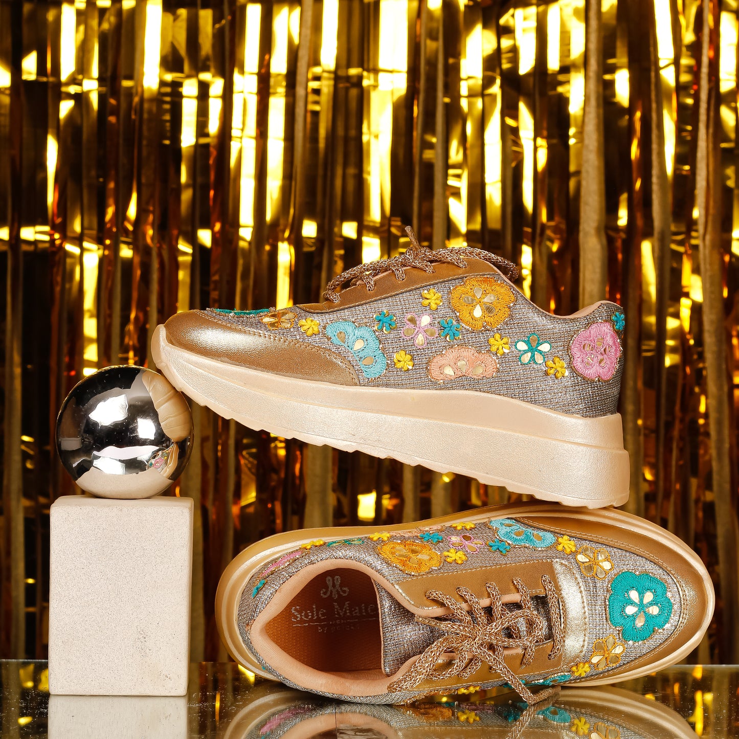 Golden Garden Floral Embroidered Sneakers styled against gold backdrop — multicolour flower appliqués with mirror work by Solemates by Palak