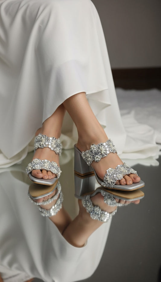 Aria silver block heels with floral pearl and sequin embellished double straps worn with white bridal outfit — 
Solemates by Palak
