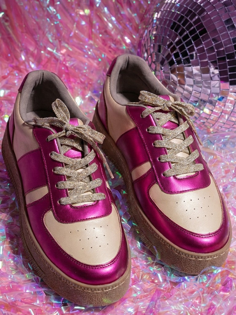 Fuchsia Flash metallic pink and cream low-top sneakers with gold glitter laces beside disco ball — Solemates by Palak