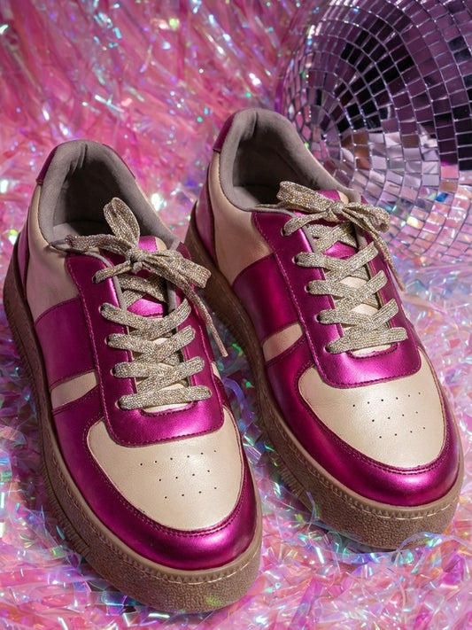 Fuchsia Flash metallic pink and cream low-top sneakers with gold glitter laces beside disco ball — Solemates by Palak