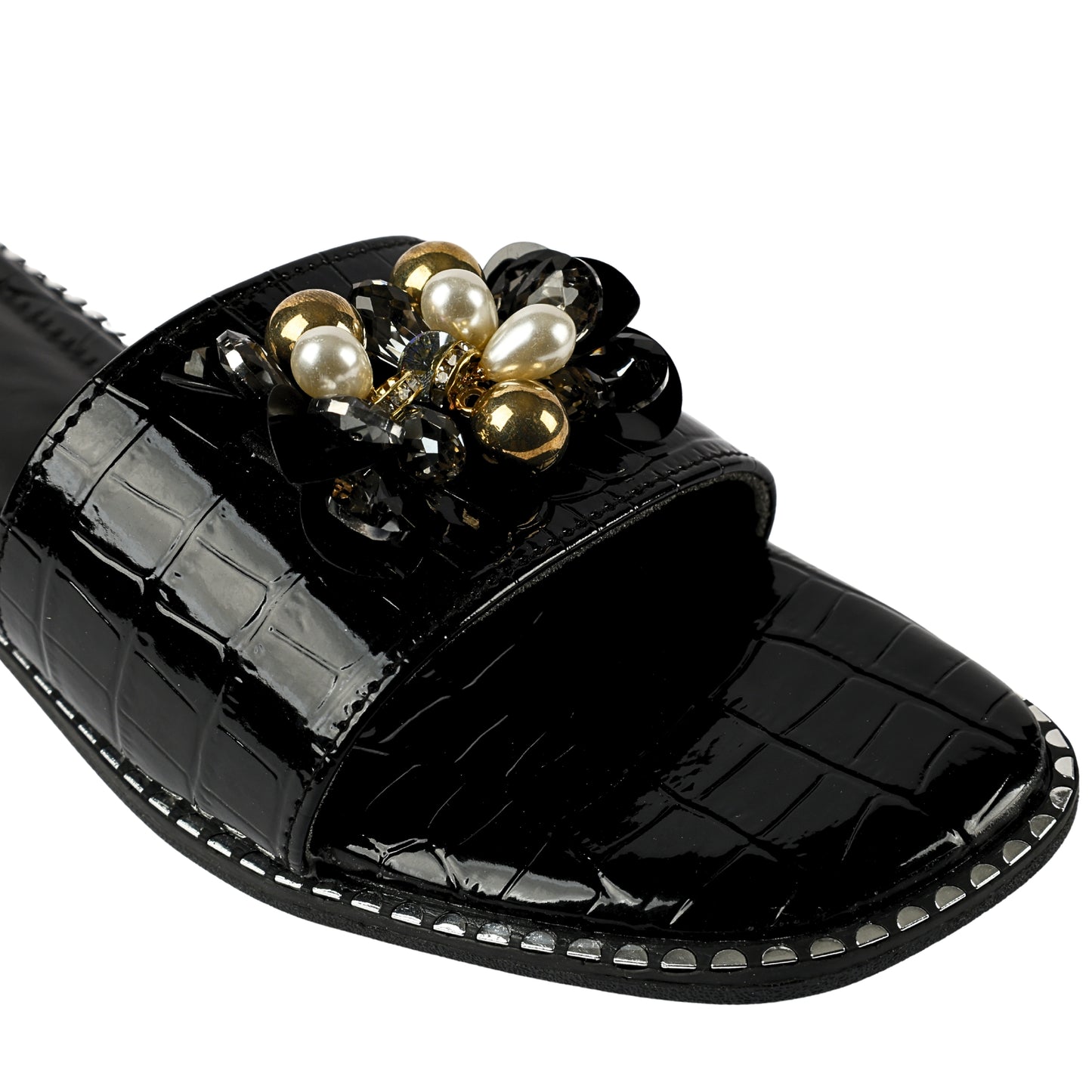 Topaz Black Flat Sliders brooch and sole close-up — white pearl drops, gold ball beads, smoky crystals and black stones on black patent croc strap with silver sole studs by Solemates by Palak