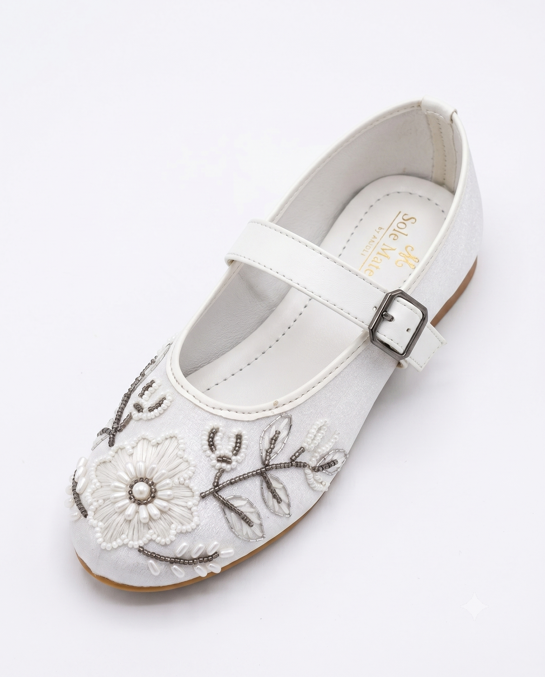 The Ballet Bloom Mary Janes angled front view — white shimmer Mary Jane with raised floral threadwork, pearl bead centres and gunmetal seed bead vine detailing by Solemates by Palak