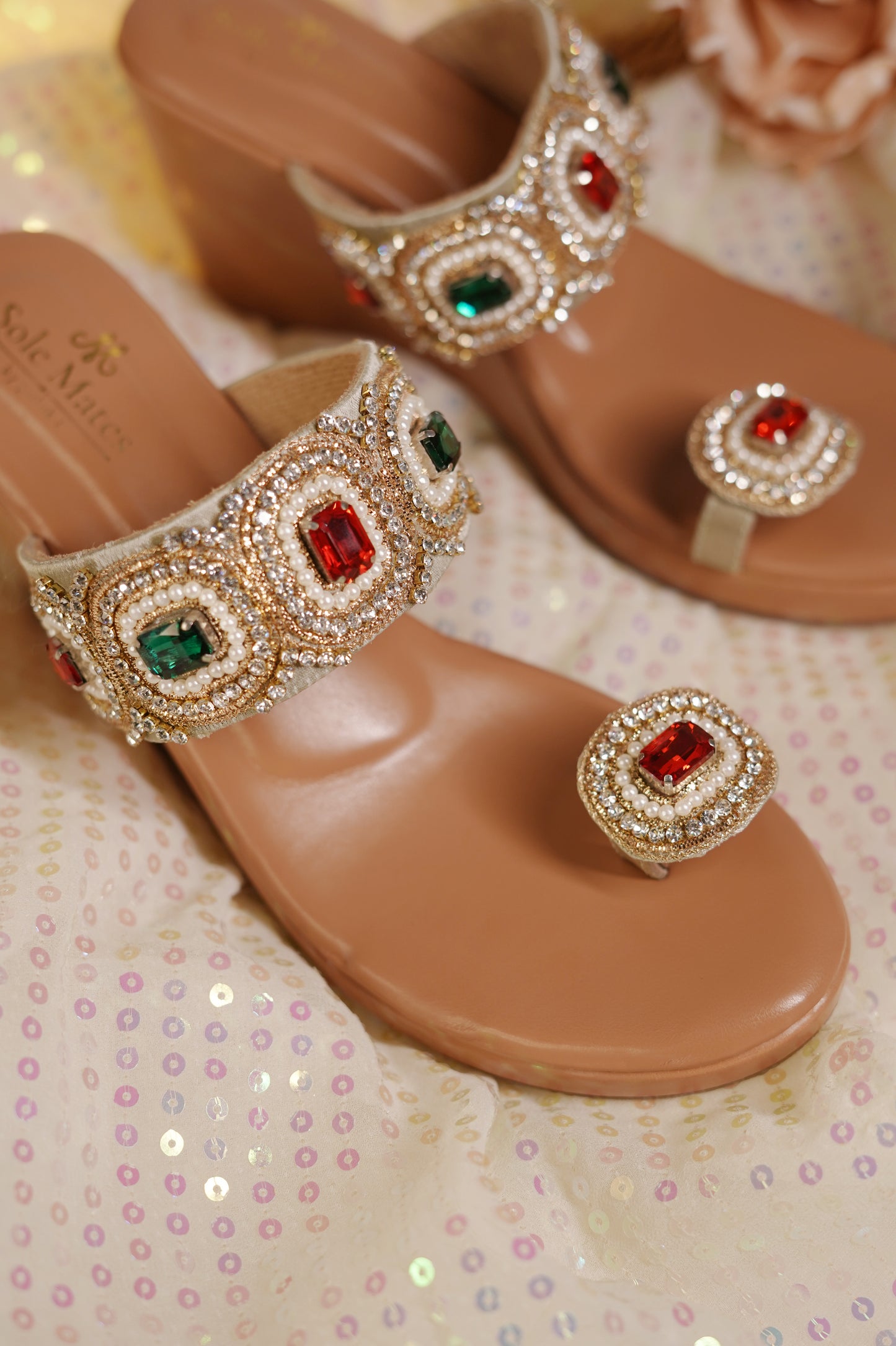 Rang Manch Kolhapuri Heels close-up — alternating ruby red and emerald green stone centerpieces in pearl-bordered circular motifs with rhinestone detailing by Solemates by Palak