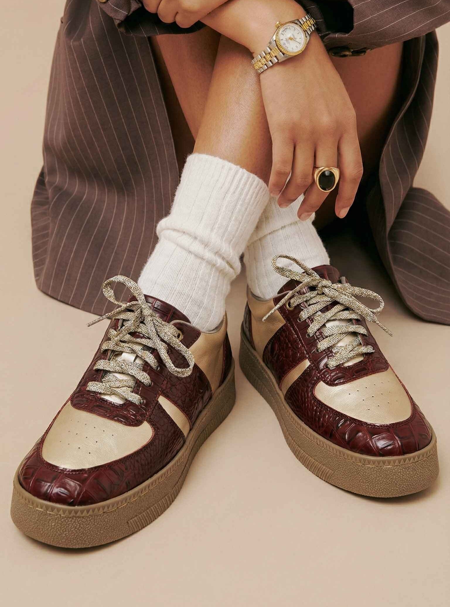 Croc Vintage burgundy croc texture and cream low-top sneakers worn with pinstripe trousers and white socks — Solemates by Palak