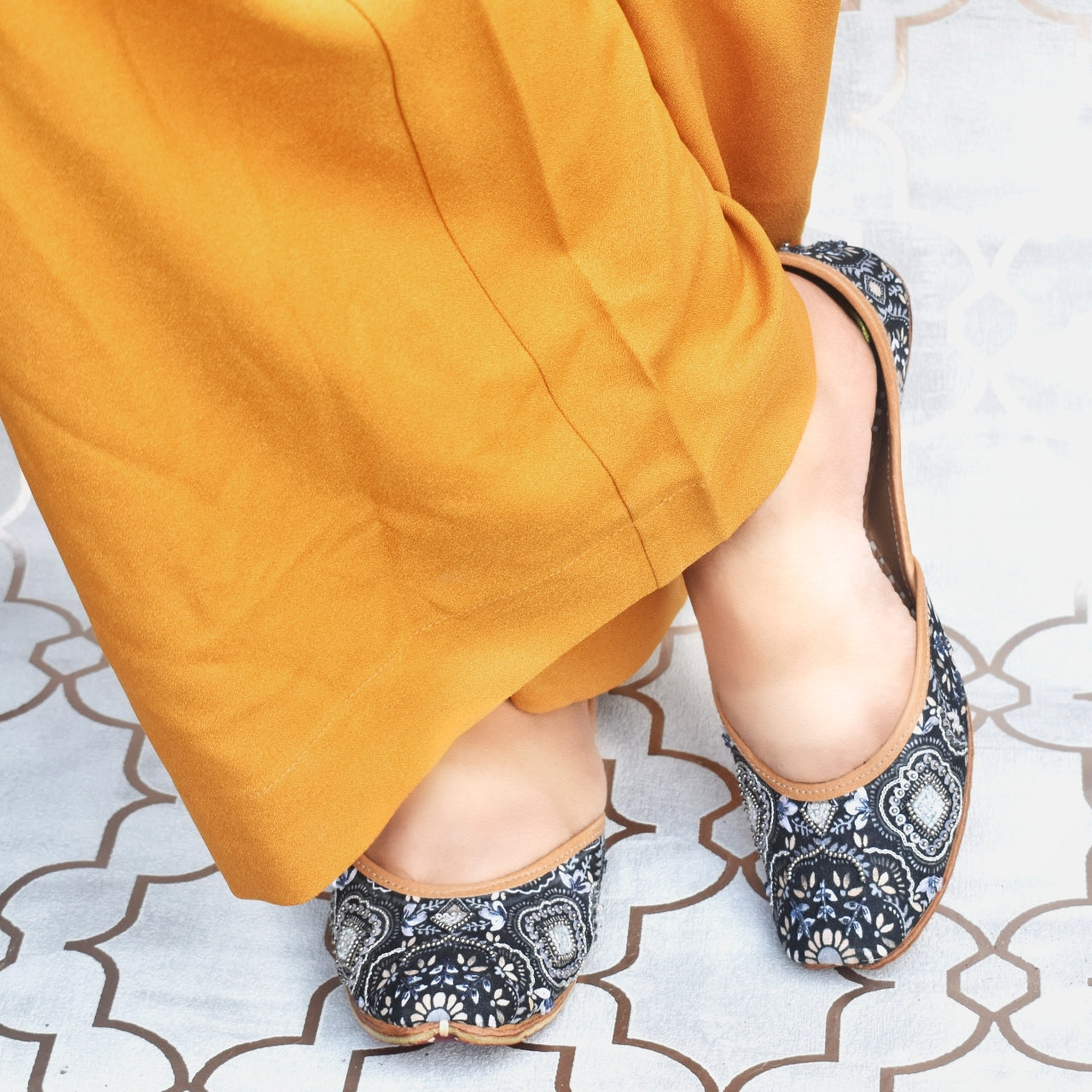 Monochrome Magic Jutti worn with mustard palazzo pants — navy floral printed jutti with silver bead embellishment by Solemates by Palak